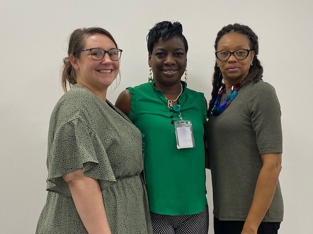 HAF Employees Smiling Community Manager Calie Giarratana, Community Manager Assistant Beverly Jones, and Community Manager Angela Smith